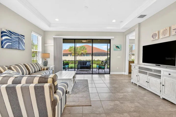 Triple sliders to lanai, crown molding and tray ceilings