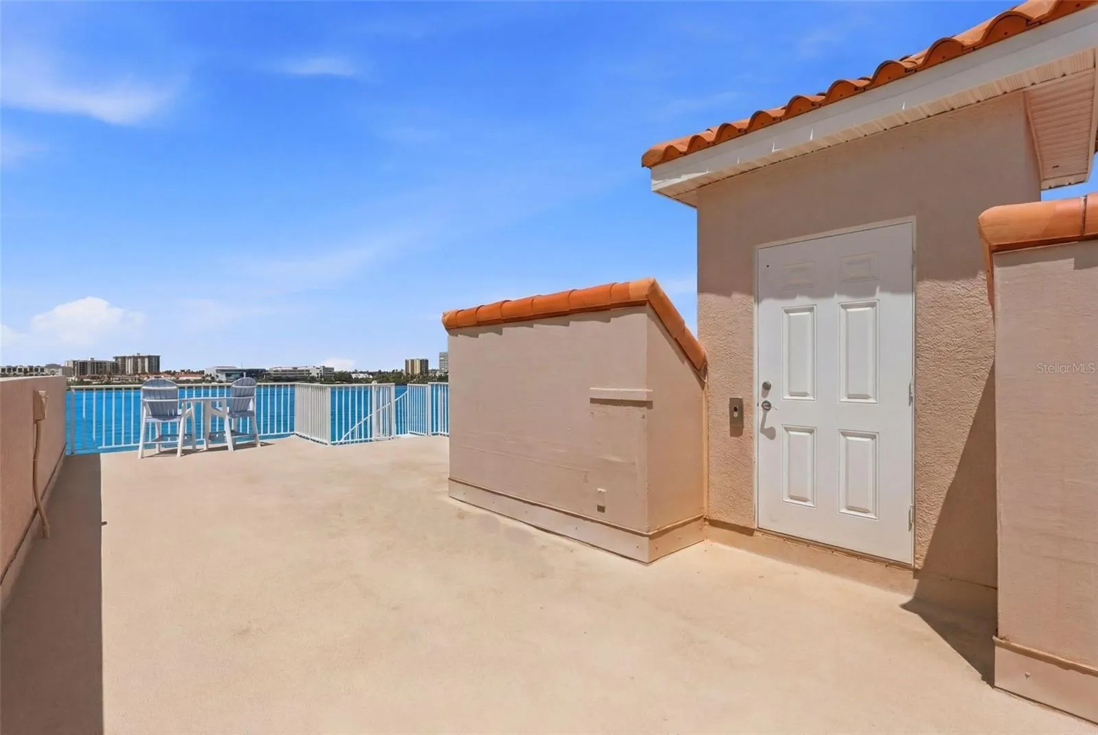 Spacious rooftop terrace with wide, open water views...absolutely lovely!!  Door is elevator entry!