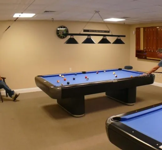 SO many amenities, including, card room, pool tables, craft room, library & more