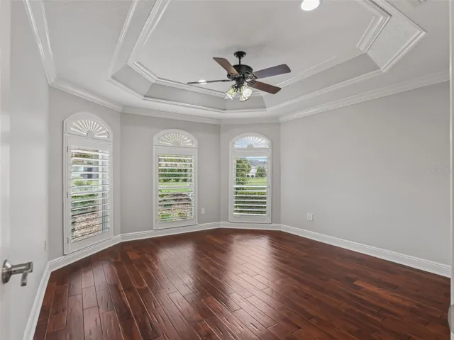 3rd room on front of home (no closet). Tray celing, plantation shutters, transoms with decorative design, hand scraped wood floors