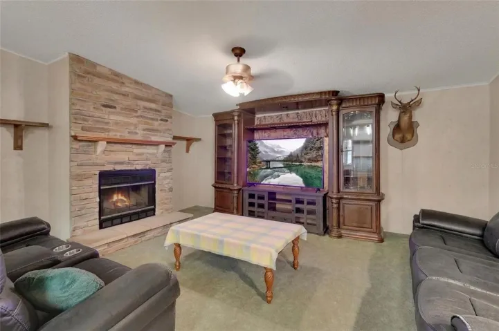 family room with wood burning fireplace