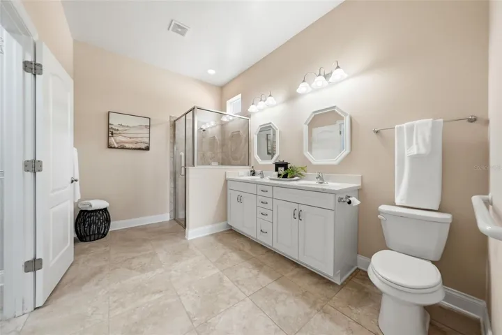 Primary bathroom with tiled walk-in shower