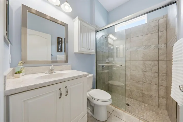 Bathroom 3 features tiled walk-in shower
