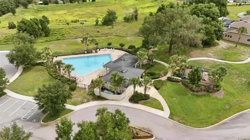 Community pool and playground at John's Lake Landing