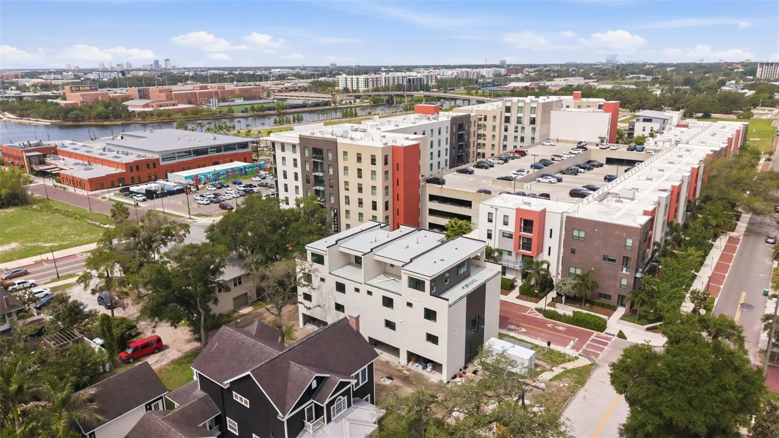 Rear View of back balcony and 2-car garage; Aramature Works and Riverwalk in background.