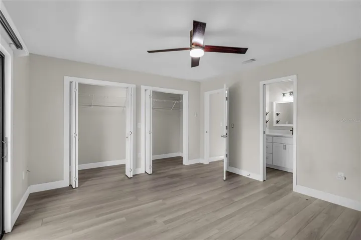 Primary bedroom offers a peaceful retreat with a generous closet and private access to a large balcony