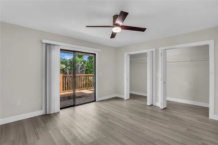 Primary bedroom offers a peaceful retreat with a generous closet and private access to a large balcony