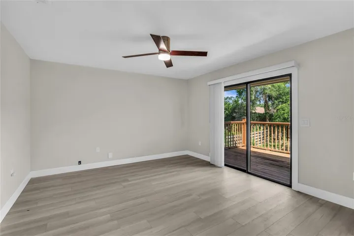 Primary bedroom offers a peaceful retreat with a generous closet and private access to a large balcony