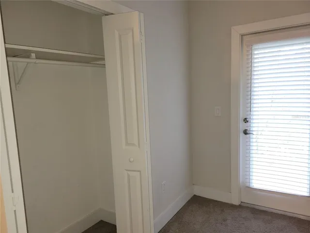 Bedroom 3 closet door and door leading to front balcony