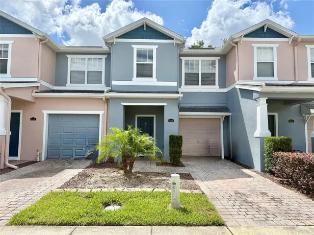 Charming Front Elevation with Paver Driveway