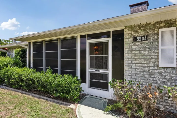 Enclosed fronr porch for additional outdoor space.