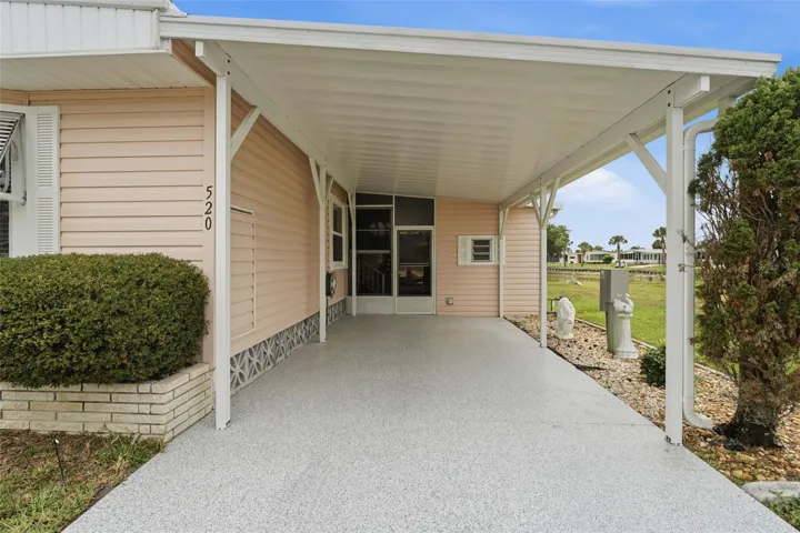 Newer carport and epoxy coated driveway