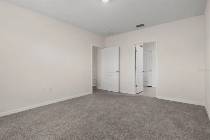 Spacious and looking at ensuite bathroom in this picture