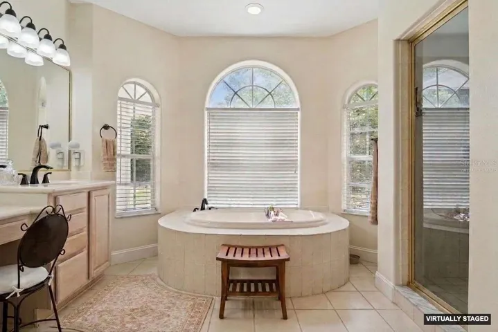 *Virtually Staged* primary en-suite bath with large soaking tub