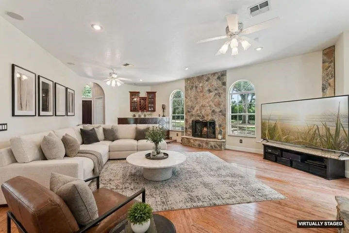 *Virtually Staged* Living room with beautiful floors & fireplace