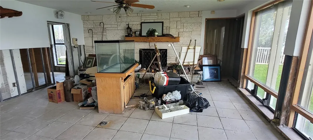 Huge family room with fireplace and water views