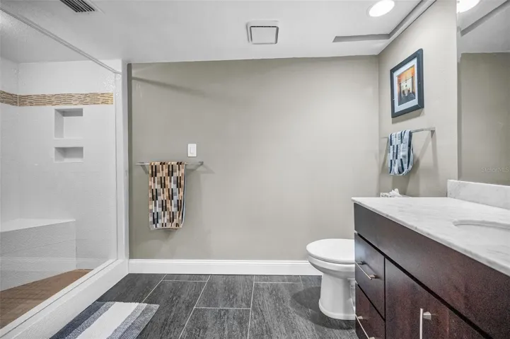 Primary updated bathroom with large waalk-in shower