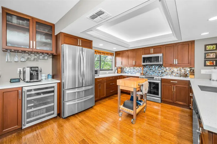 Updated kitchen with quartz countertops, stainless steel appliances