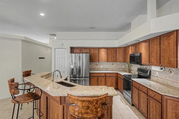 Large kitchen provides breakfast bar seating