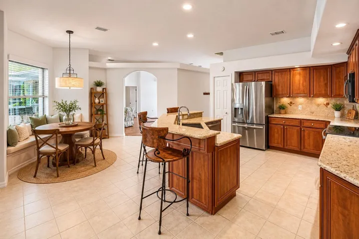 Breakfast nook seating with lanai views (virtually staged breakfast nook)
