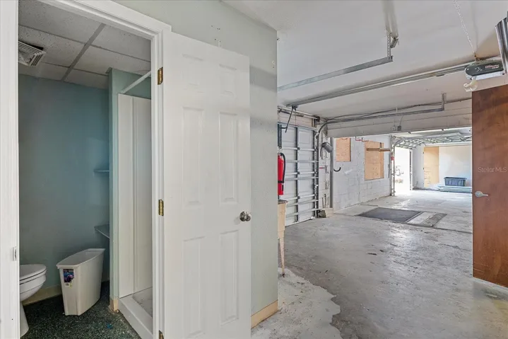 Storage/workspace accessible from two overhead doors or lower unit entry