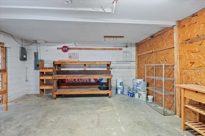 Storage/workspace accessible from two overhead doors or lower unit entry