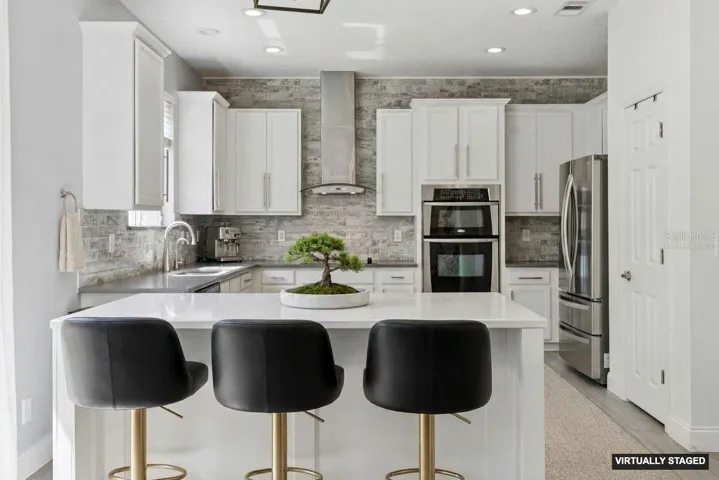 *Virtually staged* Updated kitchen with a breakfast bar