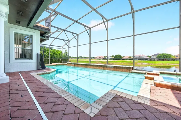 Enjoy taking in SCENIC VIEWS of the Providence Golf Club's picturesque water feature right from your own private pool.