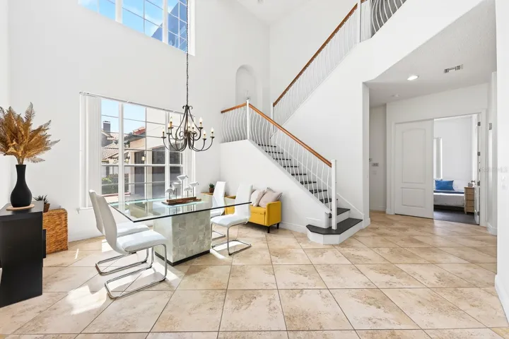 Nearby, the formal Dining Room is framed by large windows that fill the room with NATURAL LIGHT and provide lovely views of the front landscape.