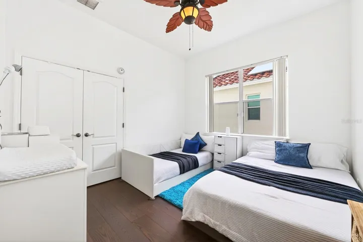 Two bedrooms are conveniently located on the main floor, each featuring NEW ENGINEERED HARDWOOD FLOORING (2024) and walk-in closets. Bedroom 2