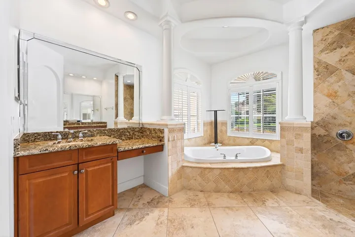 The Primary En suite features a tray ceiling, dual vanities, a jetted garden tub, walk-in shower, and private water closet.