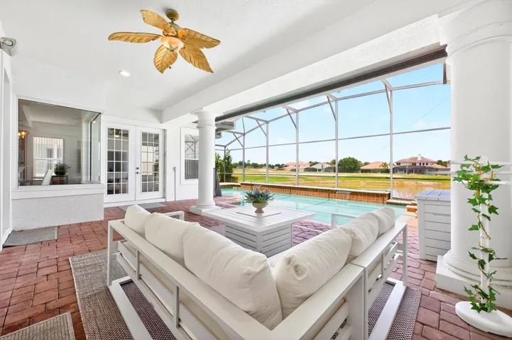 Experience ultimate relaxation in your backyard sanctuary, complete with a SCREENED-IN HEATED POOL, soothing spa, and a NEW POOL HEATER (2023), all while taking in SCENIC VIEWS of the Providence Golf Club's picturesque water feature.