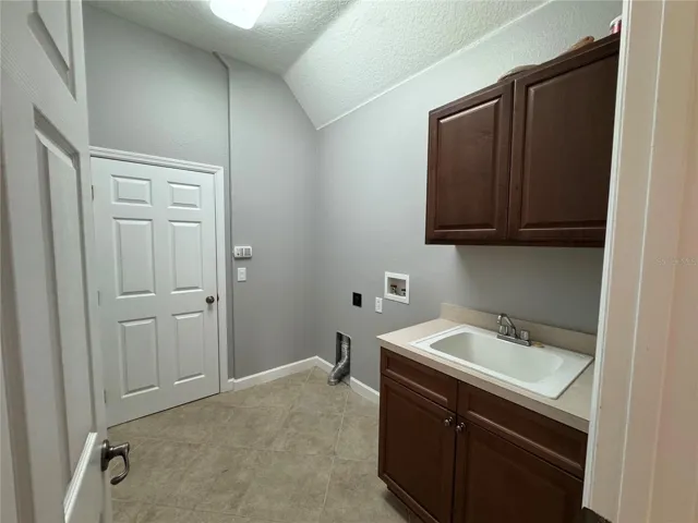 laundry room leading out to 3 car garage