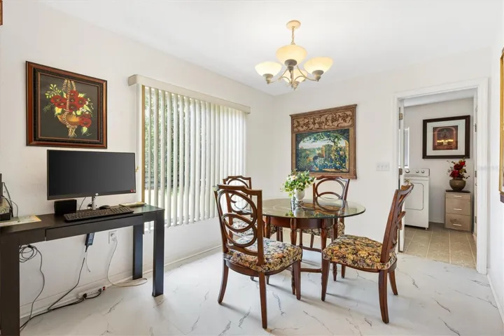 Eat-in breakfast nook in kitchen, laundry room through doorway