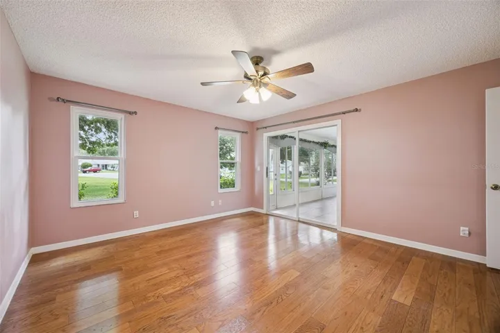 Primary bedroom with direct access to the four-season Florida Room