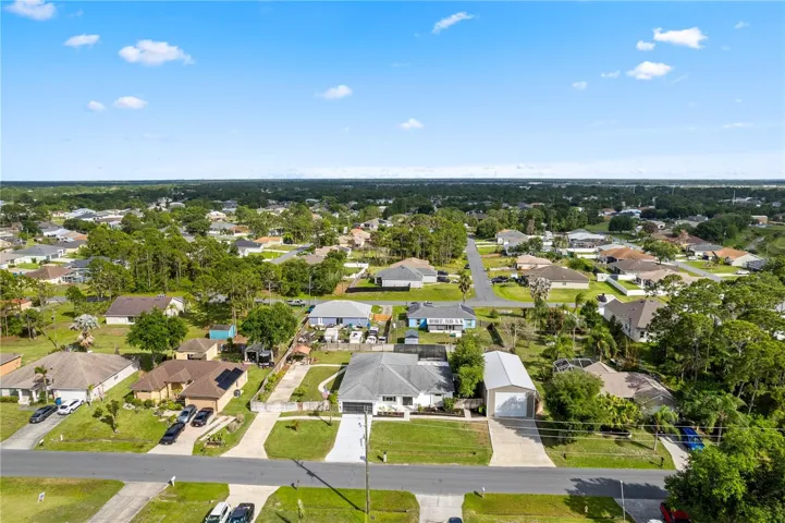 Aerial view showcasing the home’s position within a beautiful community