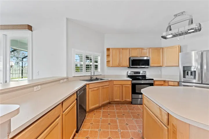 Well-appointed kitchen with ample cabinetry and counter space