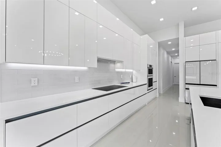 Well-appointed kitchen with ample cabinetry and counter spac