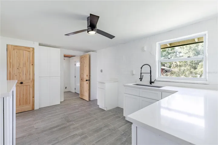 Kitchen with quartz counters and deep sink