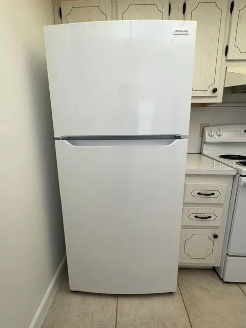 Refrigerator, updated and clean.