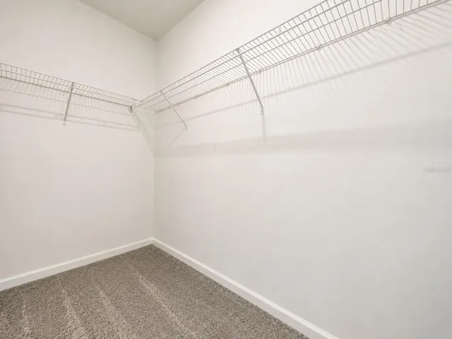 Walk-in closet inside the primary bedroom