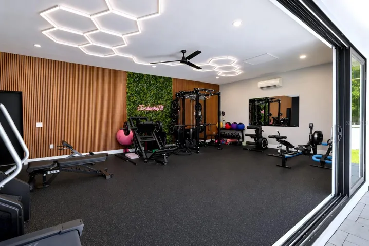 Gym with a view of the pool
