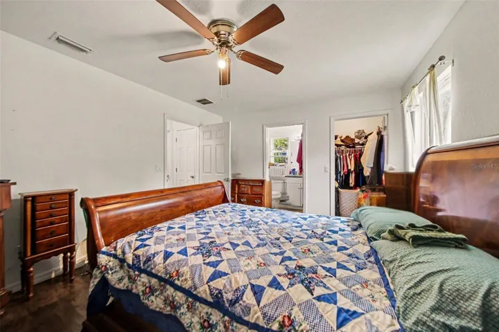 Primary Bedroom with walk-in closet, shower bathroom en suite, and natural light sweeping throughout.