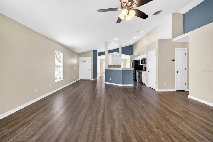 Kitchen looks out to both the dining area and living room.