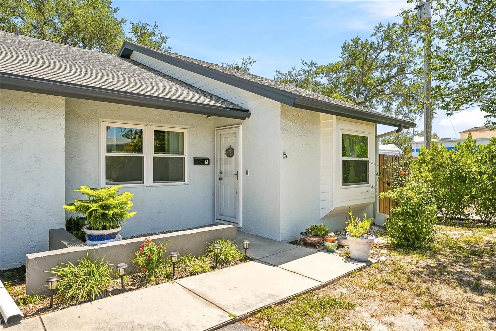 Beautifully updated single level corner/end condo that lives more like a private single-family residence.