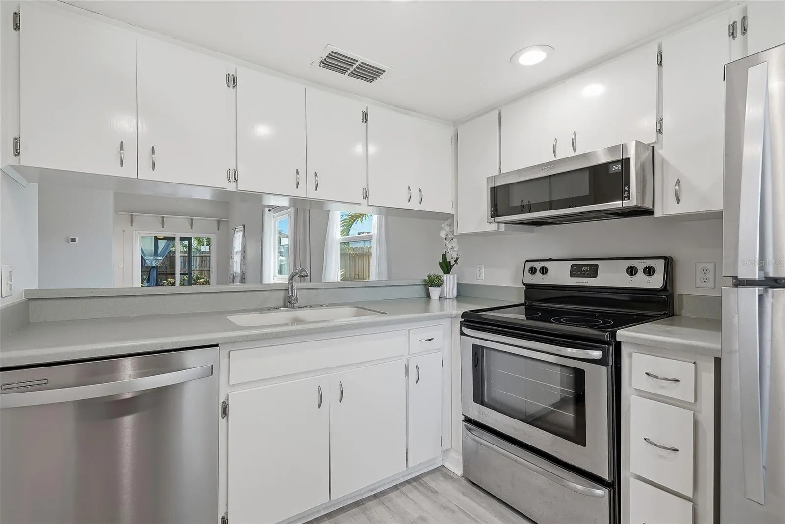Kitchen with stainless steel appliances.