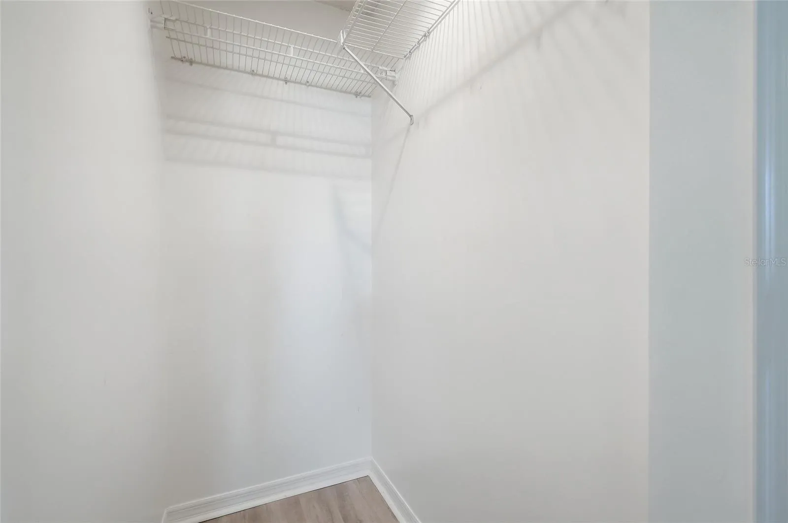 Large walk-in closet located in the Primary Bedroom.
