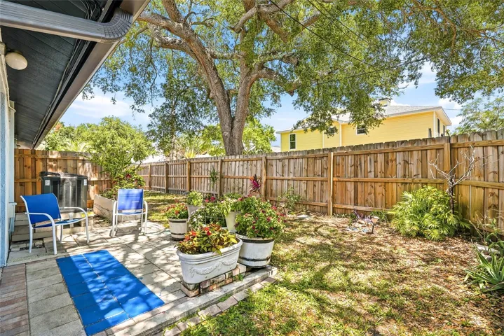 Expanded patio with pavers offers additional outdoor living space.