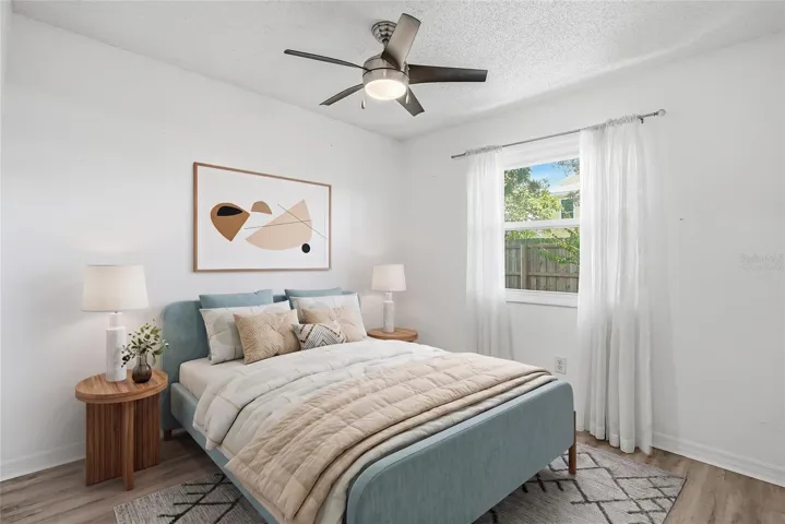 Virtually staged. Rear bedroom.