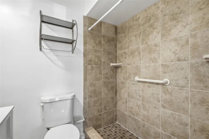 Convenience of a step- in shower within the primary ensuite bathroom.